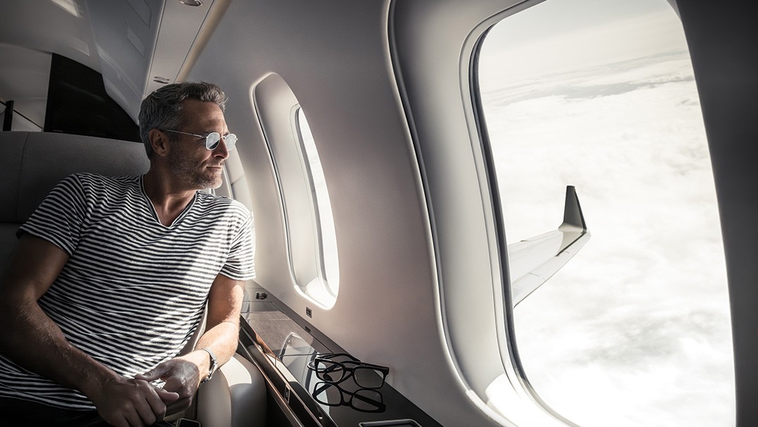 men looking at cabin window